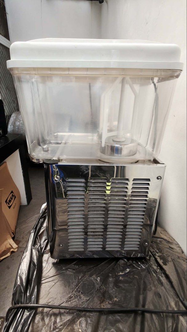 2-Tank Commercial Juice Dispenser (Category: Pitchers & Dispensers) located in Marikina City. Submitted by heytofu (Listing ID 1448313687, Image 3). Description: - Commercial-grade 2-tank juice dispenser - Model: LSJ12L x 2 - Features two clear plastic tanks with lids - Durable shiny metal base - Includes a black power cord - Ideal for cafes, restaurants, and other food service establishments RFS: nag close na ang food stall and di masyado nagami