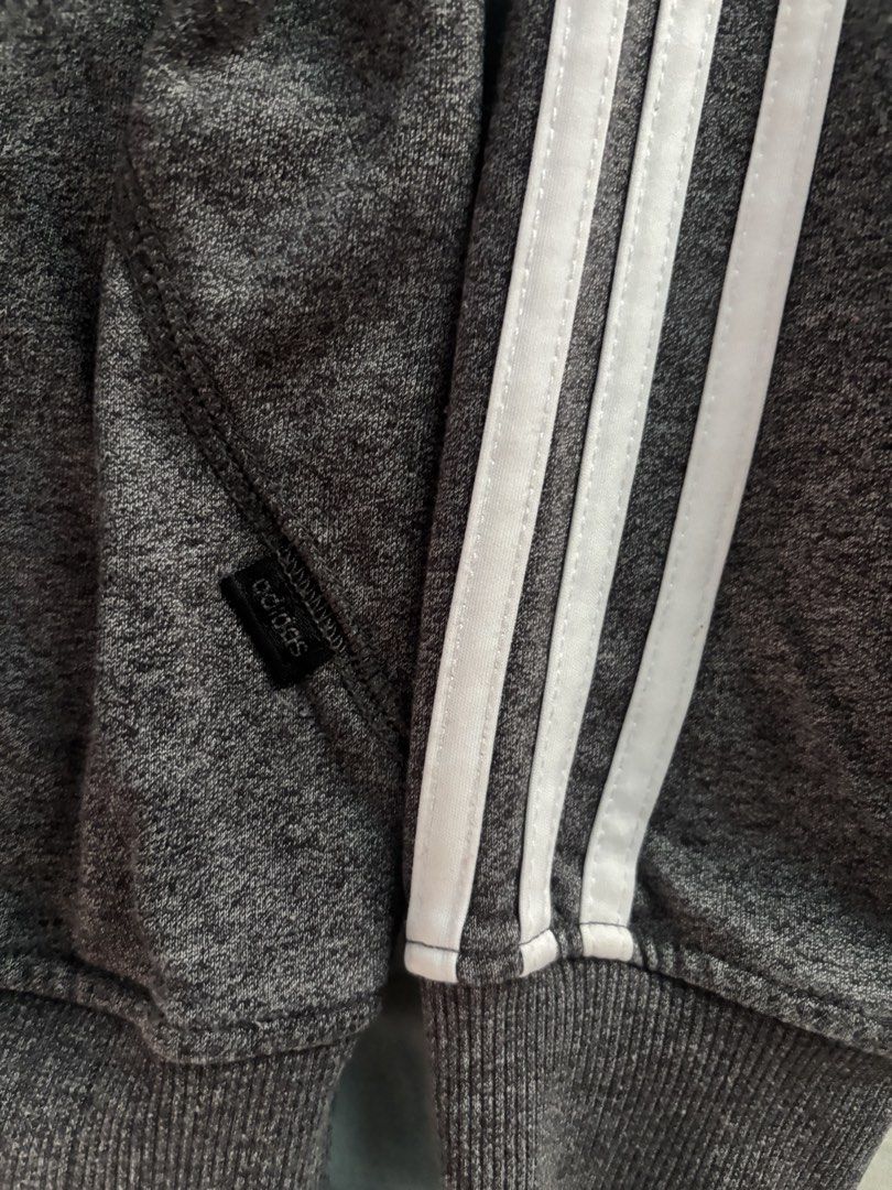 Adidas Grey Sweatshirt with 3 Stripes (Category: Longsleeves) located in Orani. Submitted by cathsclothing (Listing ID 1448318120, Image 3). Description: Large on Tag - Grey Adidas sweatshirt - Features classic three stripes on sleeves - Adidas trefoil logo on chest - Made in China - Ideal for casual wear.
