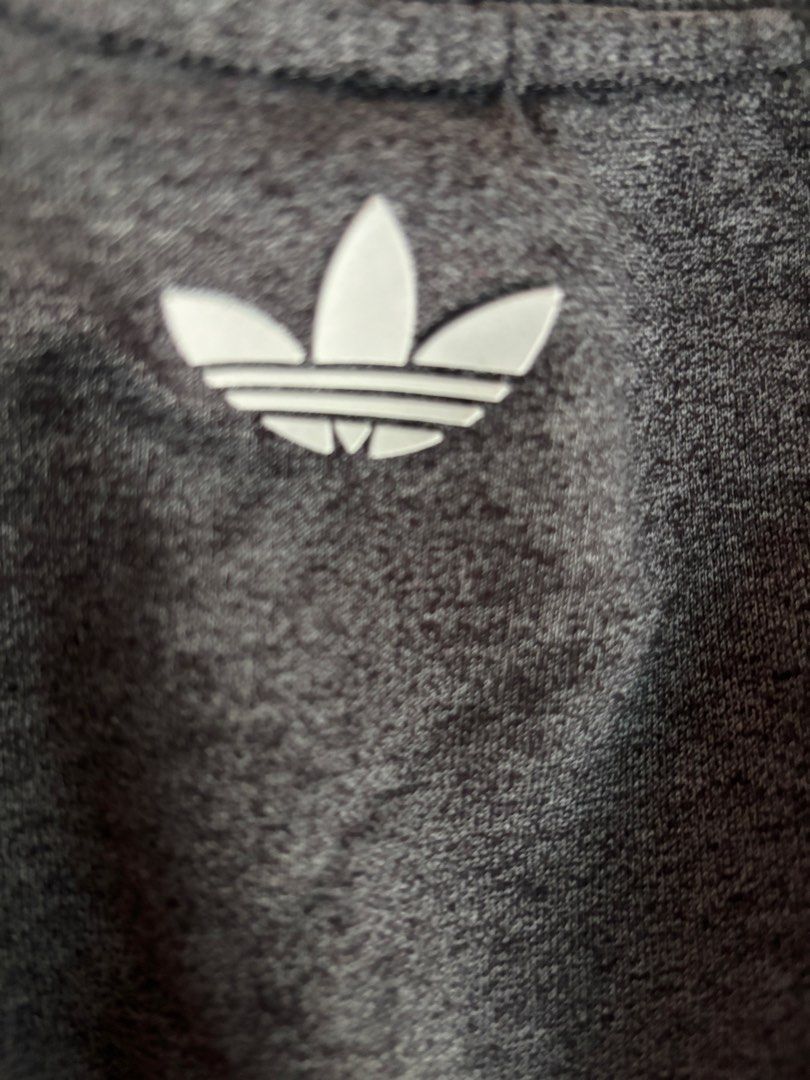 Adidas Grey Sweatshirt with 3 Stripes (Category: Longsleeves) located in Orani. Submitted by cathsclothing (Listing ID 1448318120, Image 2). Description: Large on Tag - Grey Adidas sweatshirt - Features classic three stripes on sleeves - Adidas trefoil logo on chest - Made in China - Ideal for casual wear.