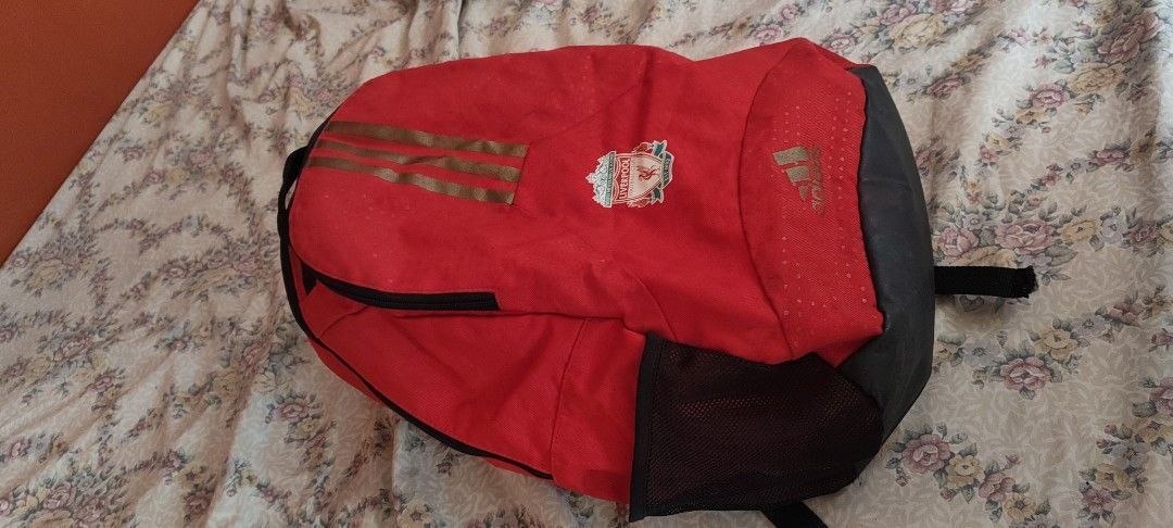 Adidas Liverpool FC Red Backpack (Category: Backpacks) located in Rizal. Submitted by auginiste (Listing ID 1448303411, Image 3). Description: - Red Adidas backpack - Features Liverpool FC crest - Gold Adidas stripes on the front - Main zip compartment - Smaller front zip pocket - Ideal for school or gym use.