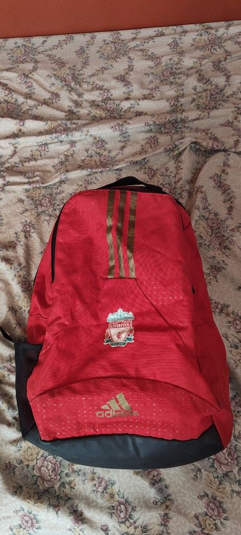 Adidas Liverpool FC Red Backpack (Category: Backpacks) located in Rizal. Submitted by auginiste (Listing ID 1448303411, Image 1). Description: - Red Adidas backpack - Features Liverpool FC crest - Gold Adidas stripes on the front - Main zip compartment - Smaller front zip pocket - Ideal for school or gym use.