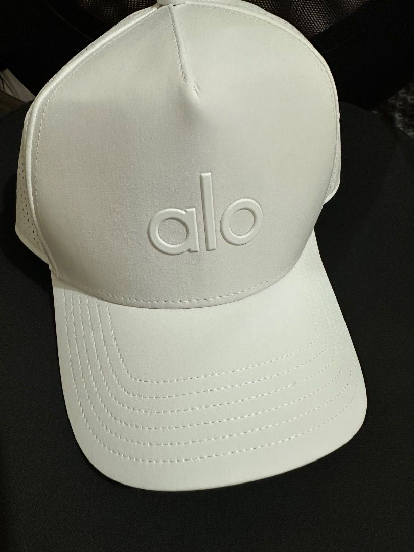 Alo Yoga White Cap (Category: Caps & Hats) located in Manila. Submitted by idips (Listing ID 1448330997, Image 1). Description: - White Alo Yoga cap - Perforated sides for enhanced breathability - Simple and clean design - Versatile for workouts or casual wear - Adjustable strap at the back for a customized fit.