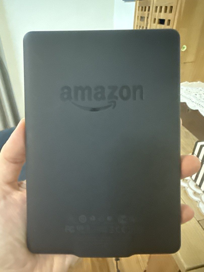 Amazon Kindle E-reader (Category: E-Readers) located in Singapore. Submitted by kittyhqc (Listing ID 1448394484, Image 1). Description: - Amazon Kindle e-reader - Color: Black - Perfect for reading books on the go - Easy to hold and use - Clear and bright screen - Good working condition - Ready for a new owner.