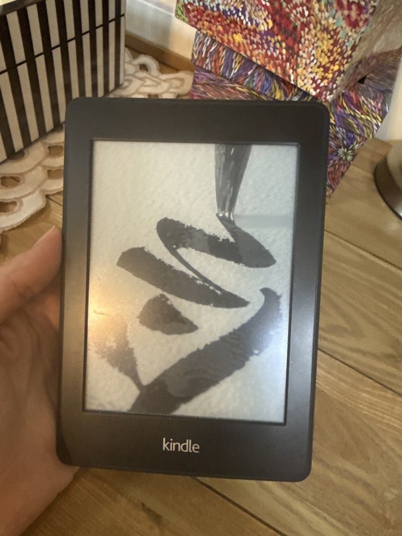 Amazon Kindle E-reader (Category: E-Readers) located in Singapore. Submitted by kittyhqc (Listing ID 1448394484, Image 2). Description: - Amazon Kindle e-reader - Color: Black - Perfect for reading books on the go - Easy to hold and use - Clear and bright screen - Good working condition - Ready for a new owner.