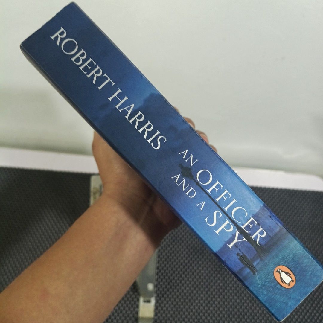 An Officer and a Spy by Robert Harris (Category: Storybooks) located in Manila. Submitted by deci1602 (Listing ID 1448469098, Image 3). Description: An Officer and a Spy by Robert Harris P300 Preloved condition Minor flaws Slight tanning MOP: GCASH MOD: JNT only (shouldered by buyer) LOC: CABUYAO, LAGUNA DM for more details!.