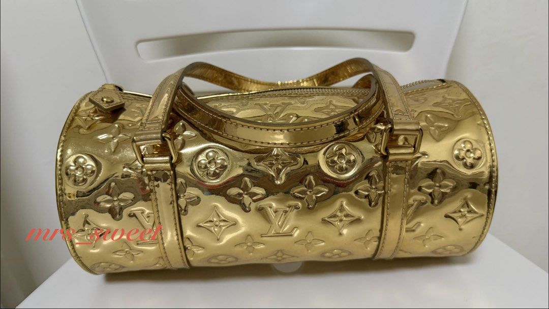 Authentic LV Gold Miroir Papillon (Category: Luxury Bags & Wallets) located in Valenzuela. Submitted by mrs_sweet (Listing ID 1448445694, Image 3). Description: - Authentic Louis Vuitton Gold Miroir Papillon bag - Iconic barrel shape - Features top handles and zipper closure - Interior is clean - Minor hairline scratches - A unique statement piece for any occasion.