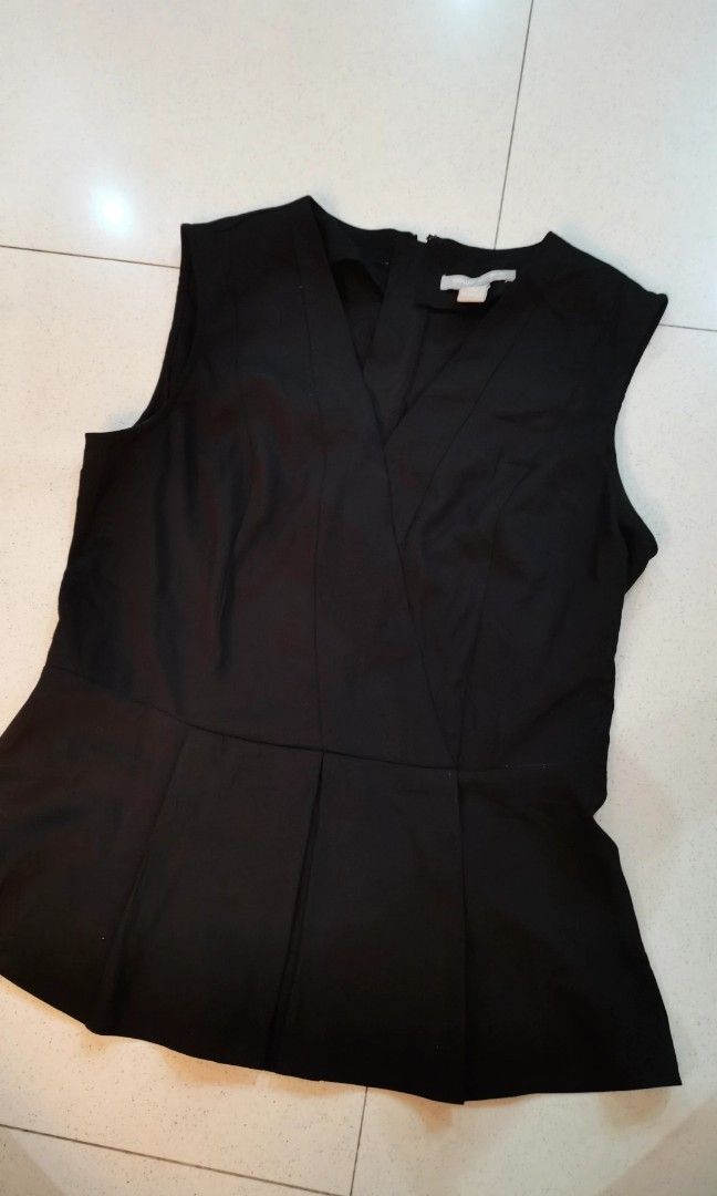 Banana Republic black peplum top (Category: Blouses) located in Batangas. Submitted by micaelaul (Listing ID 1448291285, Image 2). Description: Small-medium.