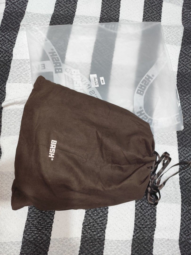 BASH* Brown Nylon Messenger Bag with Dustbag and Tags (Category: Luxury Bags & Wallets) located in Silang. Submitted by eunicenico82586 (Listing ID 1448429213, Image 2). Description: - Brand: BASH* - BRAND NEW - Color: TERRA - Material: Nylon - Style: Messenger Bag - Features: Multiple compartments, zippers - Includes: Original dustbag and tags - Ideal for: Everyday use, travel -ORIGINAL BASH BAG.