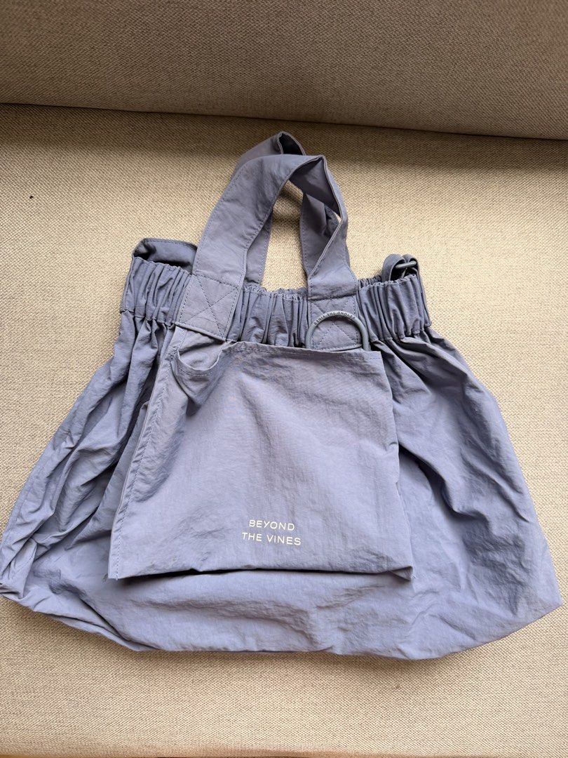 Beyond The Vines Dumpling Bag Medium Steel Blue (Category: Tote Bags) located in Mandaluyong City. Submitted by lizfaustine (Listing ID 1448311984, Image 1). Description: - Lightweight and foldable tote bag from Beyond The Vines. - Versatile dumpling bag style. - Includes a small front pouch. - Folds up compactly for easy storage. - Ideal for everyday use or travel..