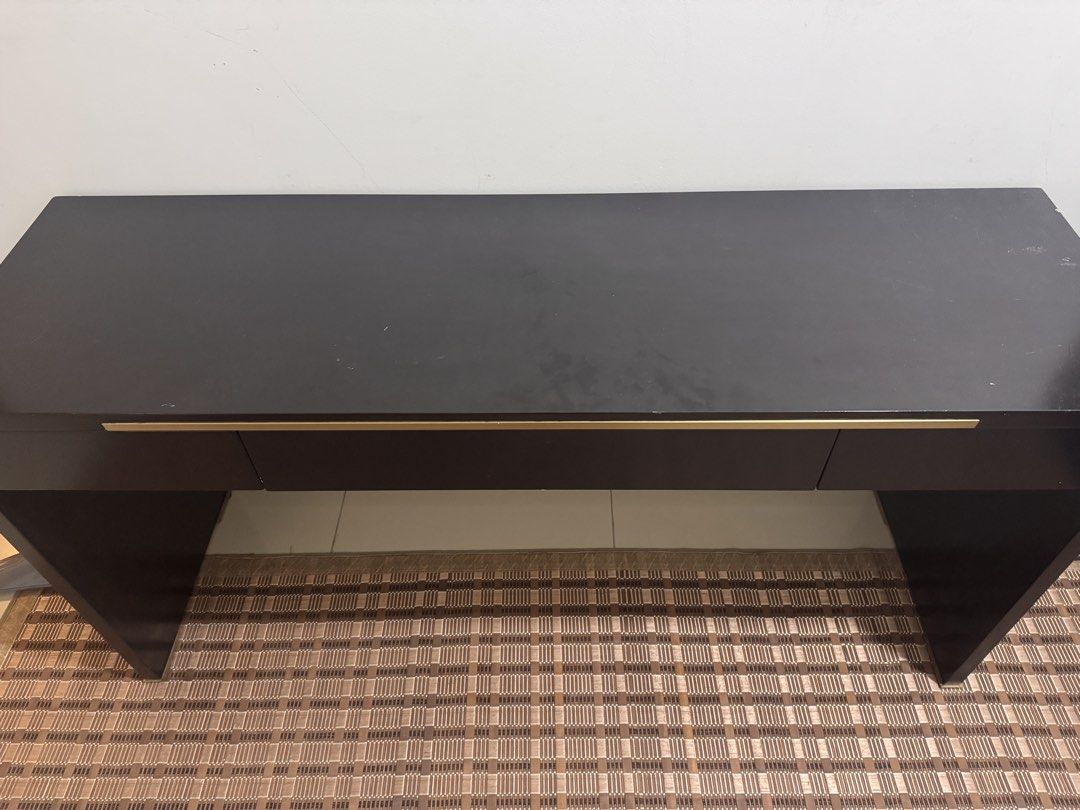 Black Solid Study Table with Drawers (Category: Tables & Sets) located in Kuala Lumpur. Submitted by heniareen (Listing ID 1448325976, Image 2). Description: - Sleek black console table - Features three convenient drawers for storage - Elegant gold handles add a touch of luxury - Ideal for your entryway or as a chic vanity - Reason for selling: Moving house - 150mm length, width 45mm, height 75mm .