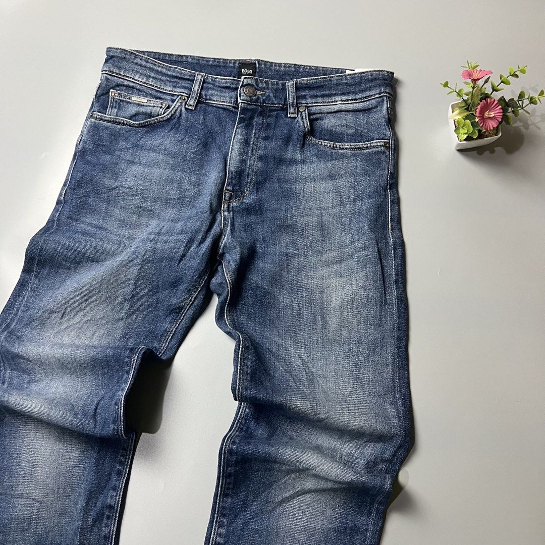 BOSS Blue Wash Denim Jeans (Category: Jeans) located in Bago City. Submitted by g___shop (Listing ID 1448478566, Image 3). Description: - Classic blue wash jeans from BOSS - Straight leg fit - Button and zip closure - Multiple pockets for convenience - Great for everyday wear - Waistline 32-34 Stretchable .