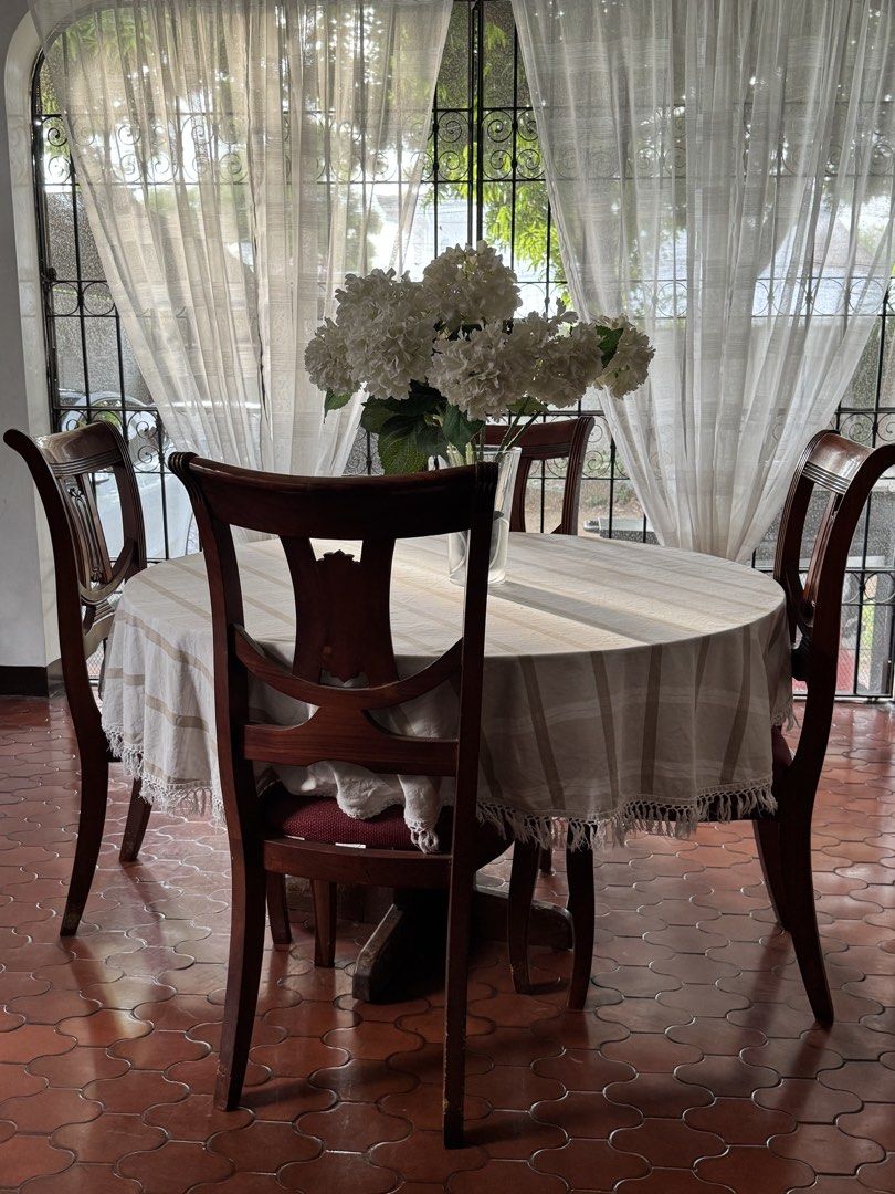 Breakfast/Dining Table Set - Glass table and chairs (Category: Tables & Sets) located in Quezon City. Submitted by foryou.ph (Listing ID 1448364019, Image 2). Description: ⚫️Wooden Chairs and table with glass top ⚫️Rfs: Moving out ⚫️ Can do pickup (Near Arca South, Taguig) .