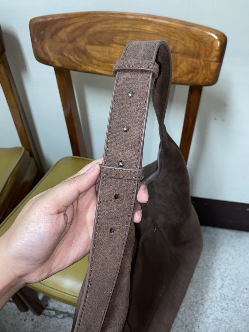 Brown Suede Hobo Bag with Front Pocket (Category: Shoulder Bags) located in Manila. Submitted by biabits (Listing ID 1448356553, Image 3). Description: - Soft brown suede hobo bag - Main zip compartment - Front pocket with metal detail - Adjustable strap with multiple holes - Great everyday bag - Plenty of space inside used for a week.