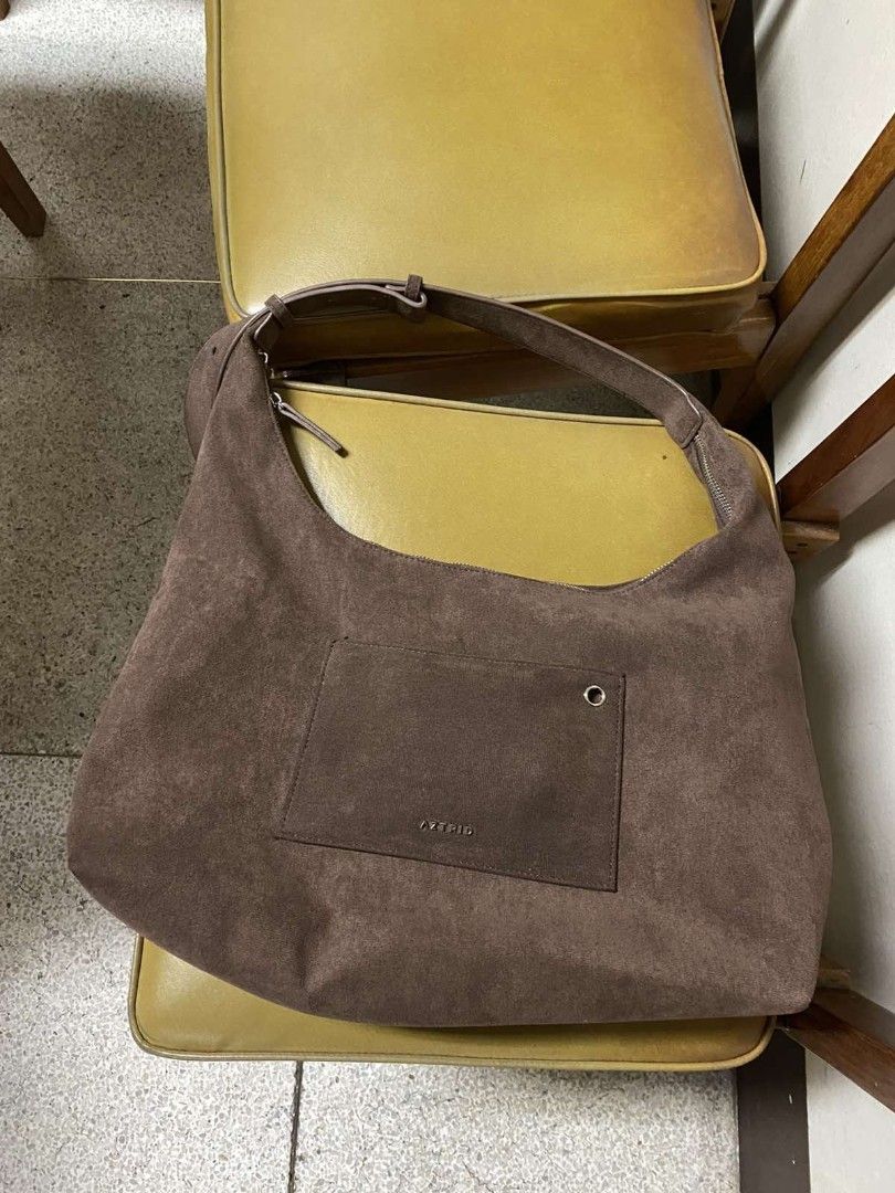 Brown Suede Hobo Bag with Front Pocket (Category: Shoulder Bags) located in Manila. Submitted by biabits (Listing ID 1448356553, Image 2). Description: - Soft brown suede hobo bag - Main zip compartment - Front pocket with metal detail - Adjustable strap with multiple holes - Great everyday bag - Plenty of space inside used for a week.