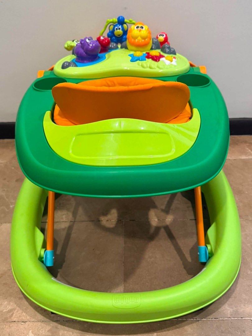 Chicco Baby Walker with Activity Tray (Category: Infant Playtime) located in Paranaque City. Submitted by reviverack1993 (Listing ID 1448458881, Image 3). Description: - Green and orange baby walker - Features a fun activity tray with toys - Padded orange seat for comfort - Ideal for babies learning to walk - Easy to maneuver - Still in good working order.