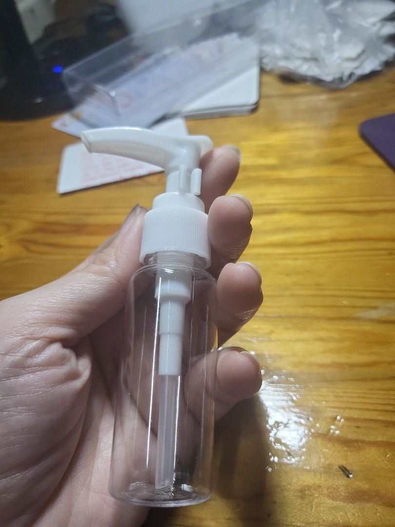 Clear Plastic Pump Bottle with White Pump Dispenser (Category: Sanitizers & Disinfectants) located in Caloocan City. Submitted by lynette1977 (Listing ID 1448304035, Image 2). Description: - Clear plastic bottle with white pump dispenser. - Ideal for travel or home use. - Suitable for liquids like lotion, soap, or sanitizer. - Functional pump mechanism, easy to refill and use. - Compact and convenient for carrying..