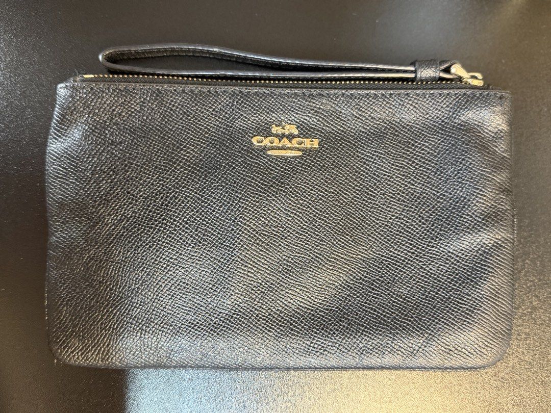 Coach Black Leather Wristlet Clutch (Category: Clutches) located in Makati City. Submitted by bagattic_etc (Listing ID 1448322344, Image 2). Description: Coach black leather wristlet with embossed logo. Detachable strap. Perfect for essentials, day or night. Made in Philippines.