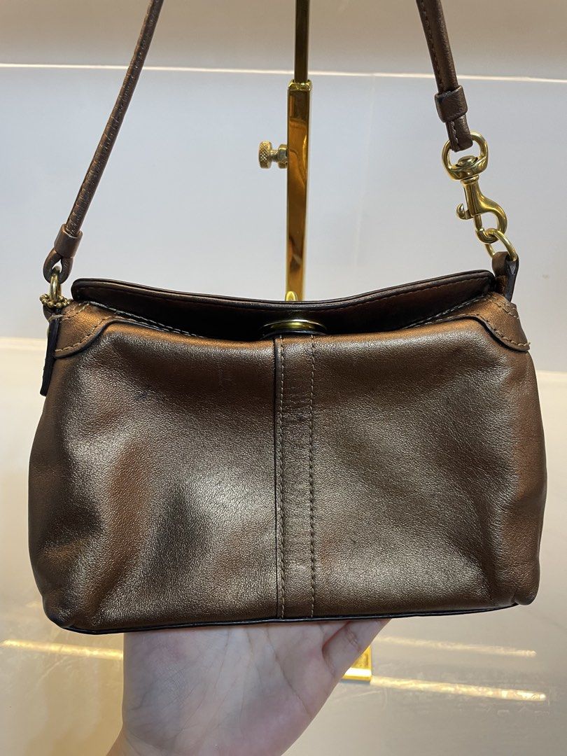 Coach Brown Leather Shoulder Bag with Turnlock Closure (Category: Luxury Bags & Wallets) located in Davao. Submitted by ishuh (Listing ID 1448395501, Image 3). Description: - Authentic Coach brown leather shoulder bag - Classic turnlock closure on the front - Beautiful leather sheen - Secure hook closure on the strap - Includes small Coach tag - Perfect for daily use.