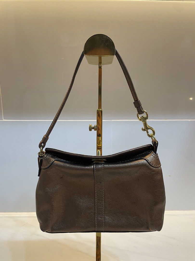 Coach Brown Leather Shoulder Bag with Turnlock Closure (Category: Luxury Bags & Wallets) located in Davao. Submitted by ishuh (Listing ID 1448395501, Image 2). Description: - Authentic Coach brown leather shoulder bag - Classic turnlock closure on the front - Beautiful leather sheen - Secure hook closure on the strap - Includes small Coach tag - Perfect for daily use.