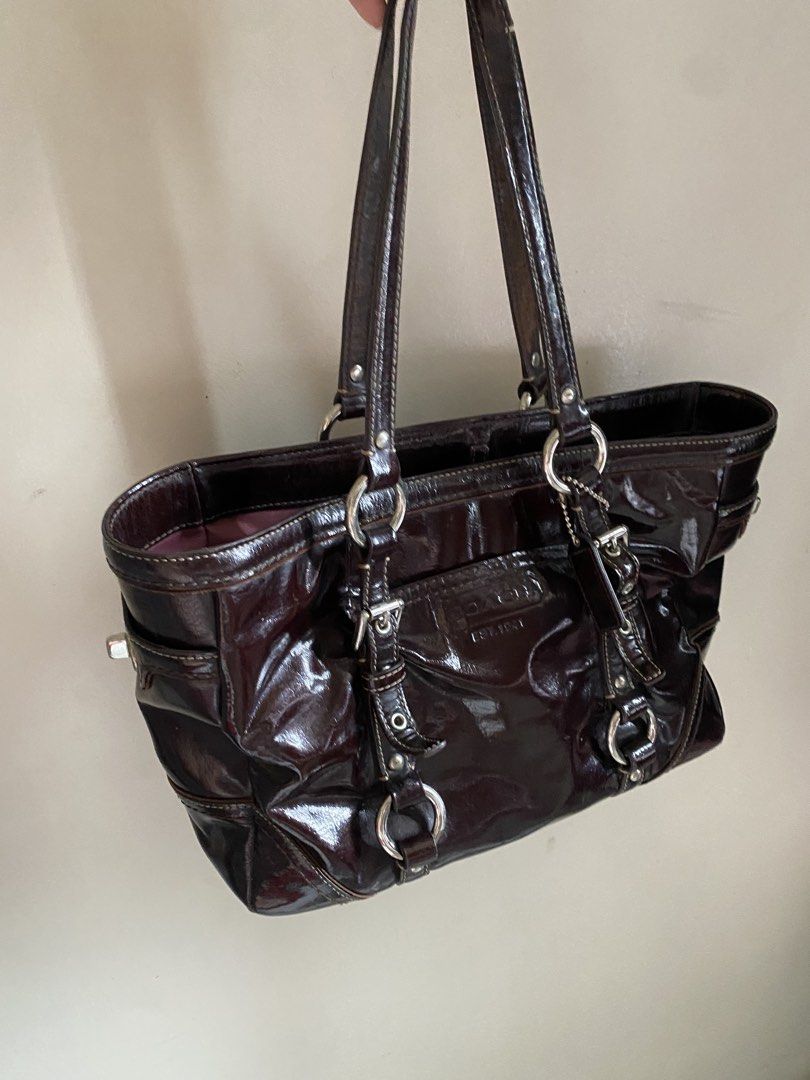 Coach Brown Patent Leather Tote Bag (Category: Luxury Bags & Wallets) located in Manila. Submitted by matchatanuki (Listing ID 1448326228, Image 1). Description: - Genuine brown patent leather Coach tote - Shiny, eye-catching finish - Elegant silver hardware details - Comfortable double shoulder straps - Multiple interior pockets for organization - Ample space for all your essentials - Ideal for everyday use and errands Reserved via ig.
