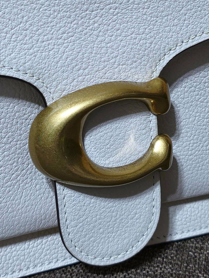 Coach Tabby Shoulder Bag 26 White Pebble Leather (Category: Luxury Bags & Wallets) located in Pasig City. Submitted by saint.chico (Listing ID 1448328508, Image 3). Description: - White pebble leather Coach Tabby bag - Signature C hardware in antique brass - Detachable crossbody strap - Spacious interior - Original tags still attached - Recently purchased.