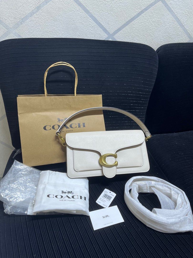 Coach Tabby Shoulder Bag 26 White Pebble Leather (Category: Shoulder Bags) located in San Pablo. Submitted by isshhhhh (Listing ID 1448445899, Image 1). Description: - Authentic Coach Tabby Bag - Color: White - Material: Pebble Leather - Hardware: Brass with iconic C logo - Includes: Dust bag, paper bag, and strap - Interior: Zip pocket and slip pockets - Versatile: Ideal for everyday or nights out.