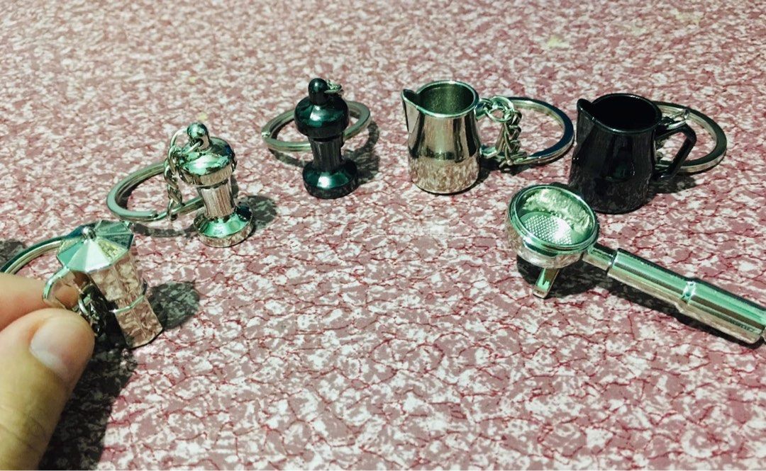 Coffee Machine & Accessories Keychains Set (Category: Coffee Machines & Makers) located in Manila. Submitted by mercy14_moon (Listing ID 1448344334, Image 1). Description: - Adorable coffee-themed keychain set. - Includes: Moka pot, silver & black milk pitcher, tamper, and another coffee maker design. - Ideal gift for coffee enthusiasts and baristas. - Perfect for personalizing keys, bags, or backpacks..