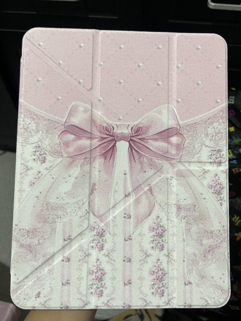 coquette ipad air m4 11 in case (Category: Cases & Sleeves) located in Koronadal. Submitted by hiiiii.hello (Listing ID 1448440099, Image 1). Description: used only for less than a week no issue/s light pink siya in person y-fold / trifold case mop gcash mod j&t.