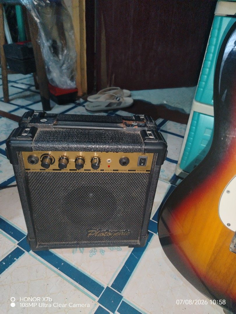 Crescent Electric Guitar with Amplifier and Cable (Category: Musical Instruments) located in Valenzuela. Submitted by henbaluyan (Listing ID 1448302594, Image 2). Description: - Crescent electric guitar with classic sunburst finish. - Strat-style design, ideal for learning. - Comes with a compact and portable amplifier. - Includes a guitar cable. - Great starter set for aspiring musicians..