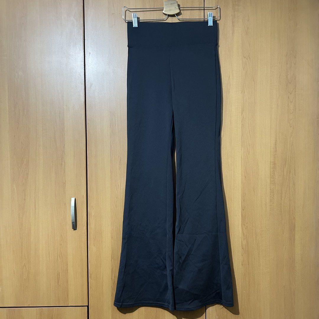 Dark Gray Flared Pants (Category: Other Bottoms) located in Mandaluyong City. Submitted by vwonu (Listing ID 1448404501, Image 1). Description: - High quality -Upto waist 32 -Stylish black high-waisted flared pants - Comfortable stretchy material - Flattering wide leg opening - Versatile: great for casual or dressed-up looks - Easy to pair with various tops and shoes - Ideal for everyday outfits.