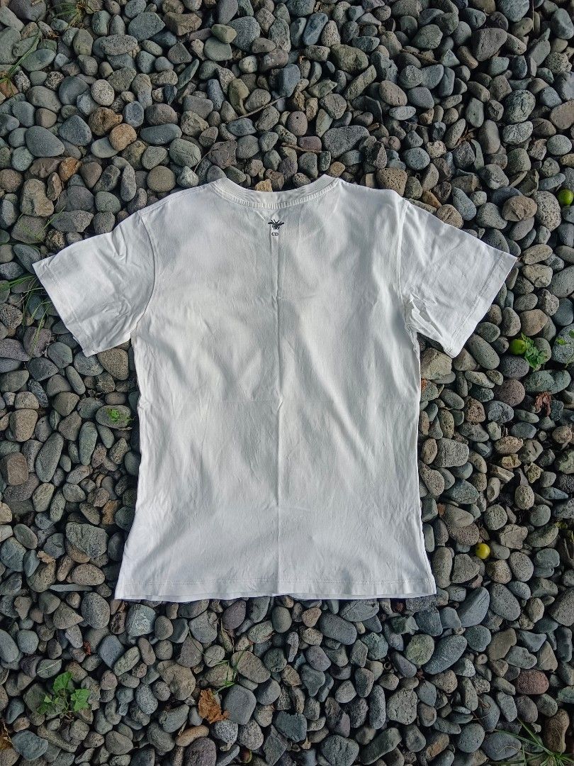 Dior T-shirt with Graphic Print (Category: Shirts) located in Tarlac. Submitted by khrizson16 (Listing ID 1448366674, Image 2). Description: - Cream colored Dior t-shirt - Features 'SHOULD WE ALL BE FEMINISTS' graphic print on the front - Classic crew neck and short sleeves - Plain back - Perfect for making a statement.