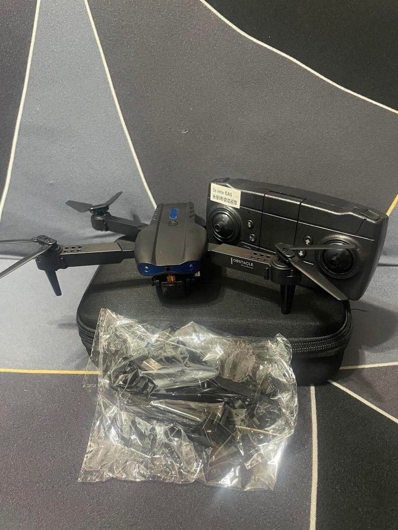 Foldable Drone with Remote Control and Case (Category: Drones) located in Manila. Submitted by riyellacruz21 (Listing ID 1448479573, Image 3). Description: - Foldable drone for easy portability - Includes remote control - Comes with a carrying case - Extra propellers included - Charging cables provided - Ready for flight - Ideal for aerial photography and recreational use - Compact and travel-friendly.