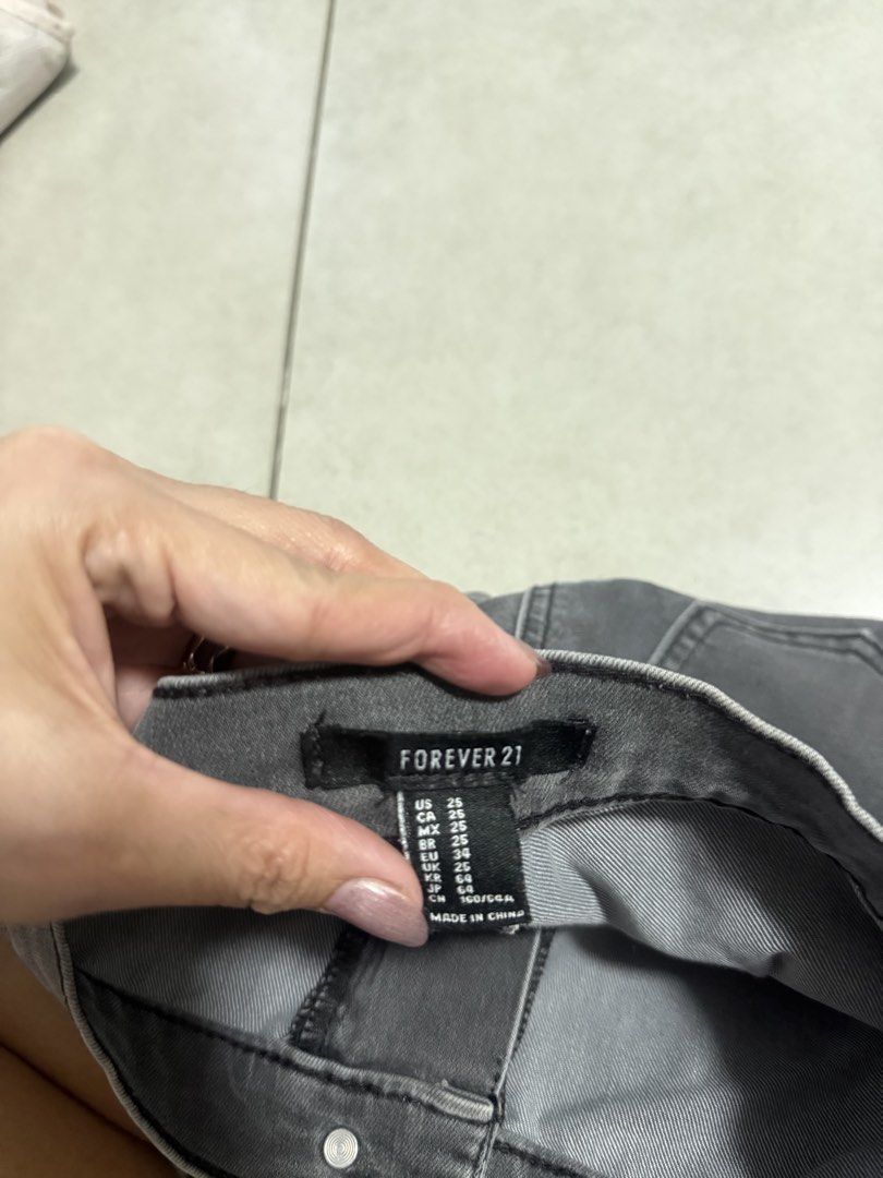 Forever 21 Grey Denim High Waisted Shorts (Category: Shorts) located in Imus. Submitted by danessalyn (Listing ID 1448425388, Image 2). Description: - Forever 21 Grey Denim Shorts - High-waisted style - Button and zip front closure - Two back pockets - Washed denim look - Comfortable fit.