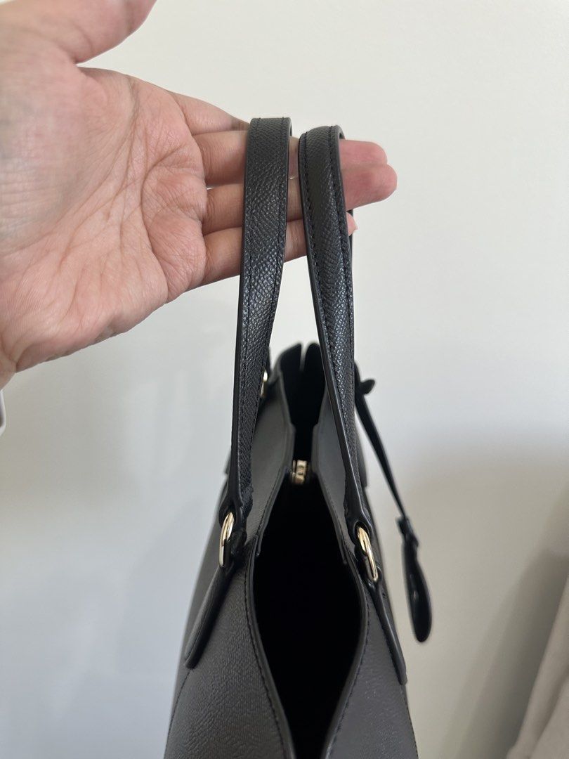 Furla Black Leather Tote Bag (Category: Luxury Bags & Wallets) located in Taguig. Submitted by wildcloud_d77321 (Listing ID 1448277989, Image 3). Description: - Classic black Furla tote bag - Made from textured leather - Features top handles - Detachable Furla logo charm - Spacious interior - Ideal for daily use or work - Comes with original Furla paper bag.