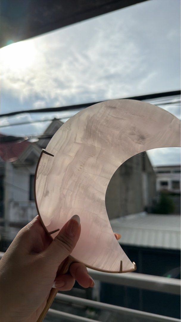 Glourite natural Crystal Moon with Stand (Category: Other Home Decor) located in Manila. Submitted by _tala_17 (Listing ID 1448483824, Image 3). Description: - Includes a sturdy metal stand. - Features unique natural patterns and a gentle glow. - Measures approximately 7 inches in height. - Ideal for home decoration or as a thoughtful gift..