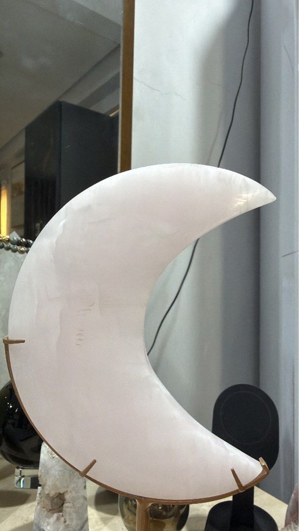 Glourite natural Crystal Moon with Stand (Category: Other Home Decor) located in Manila. Submitted by _tala_17 (Listing ID 1448483824, Image 1). Description: - Includes a sturdy metal stand. - Features unique natural patterns and a gentle glow. - Measures approximately 7 inches in height. - Ideal for home decoration or as a thoughtful gift..