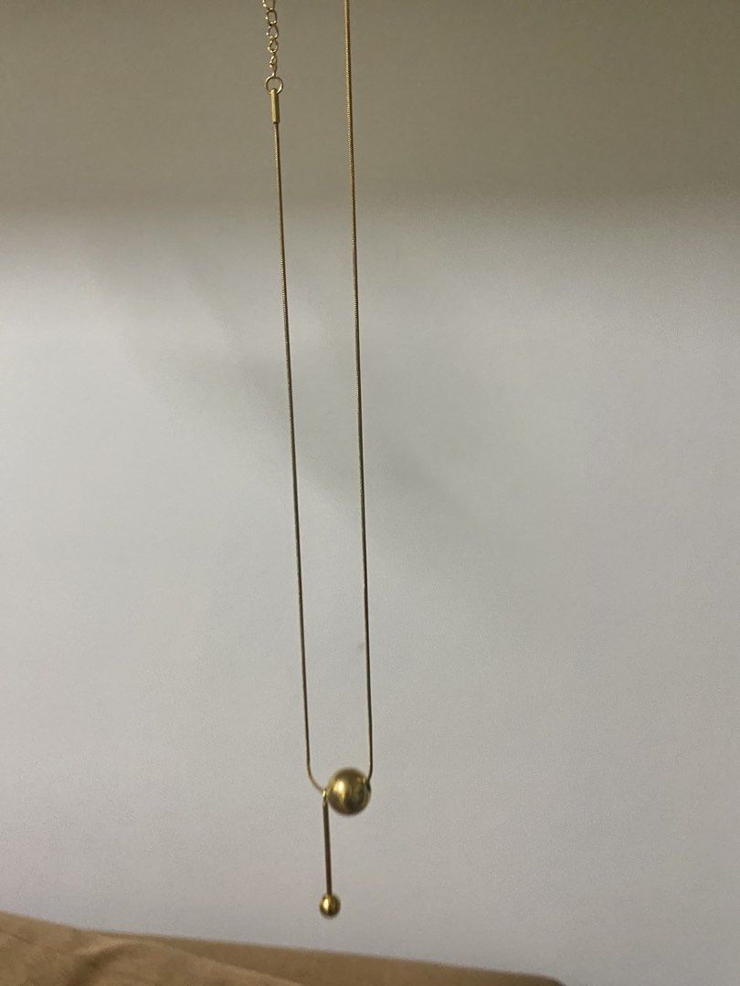 Gold Ball Pendant Necklace (Category: Necklaces) located in Makati City. Submitted by dpjanssen (Listing ID 1448438117, Image 2). Description: - Simple gold necklace - Unique ball pendant design - Delicate and adjustable chain - Ideal for layering or wearing solo - Minimalist style, complements any outfit -last price posted.