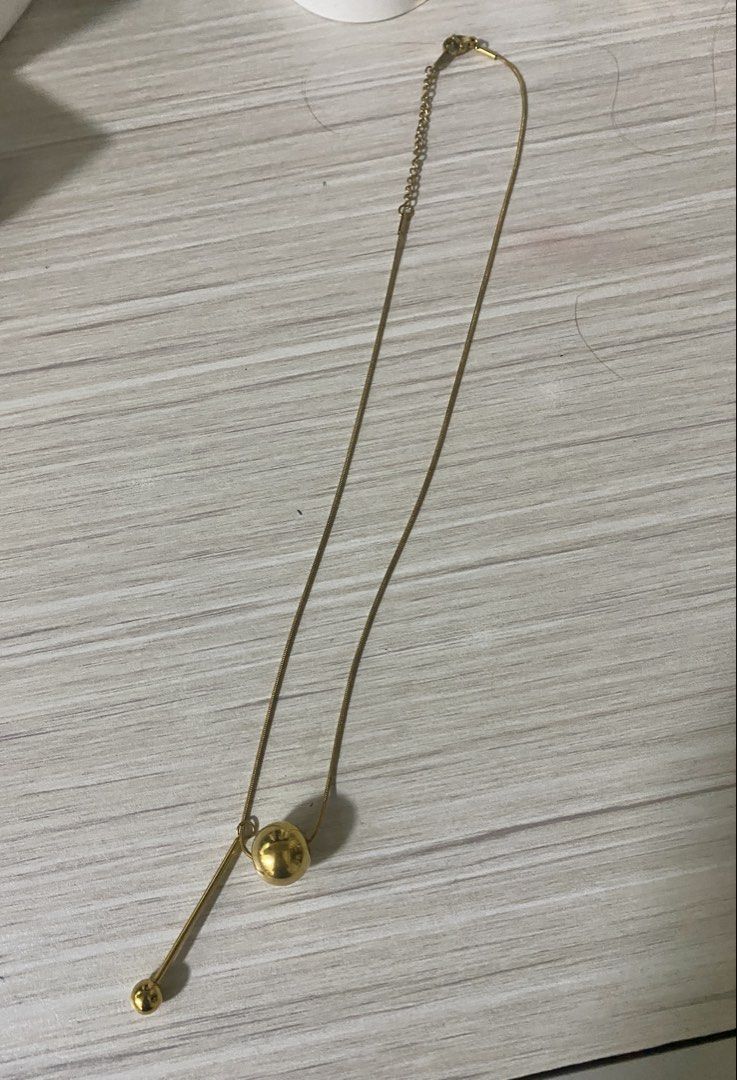 Gold Ball Pendant Necklace (Category: Necklaces) located in Makati City. Submitted by dpjanssen (Listing ID 1448438117, Image 1). Description: - Simple gold necklace - Unique ball pendant design - Delicate and adjustable chain - Ideal for layering or wearing solo - Minimalist style, complements any outfit -last price posted.