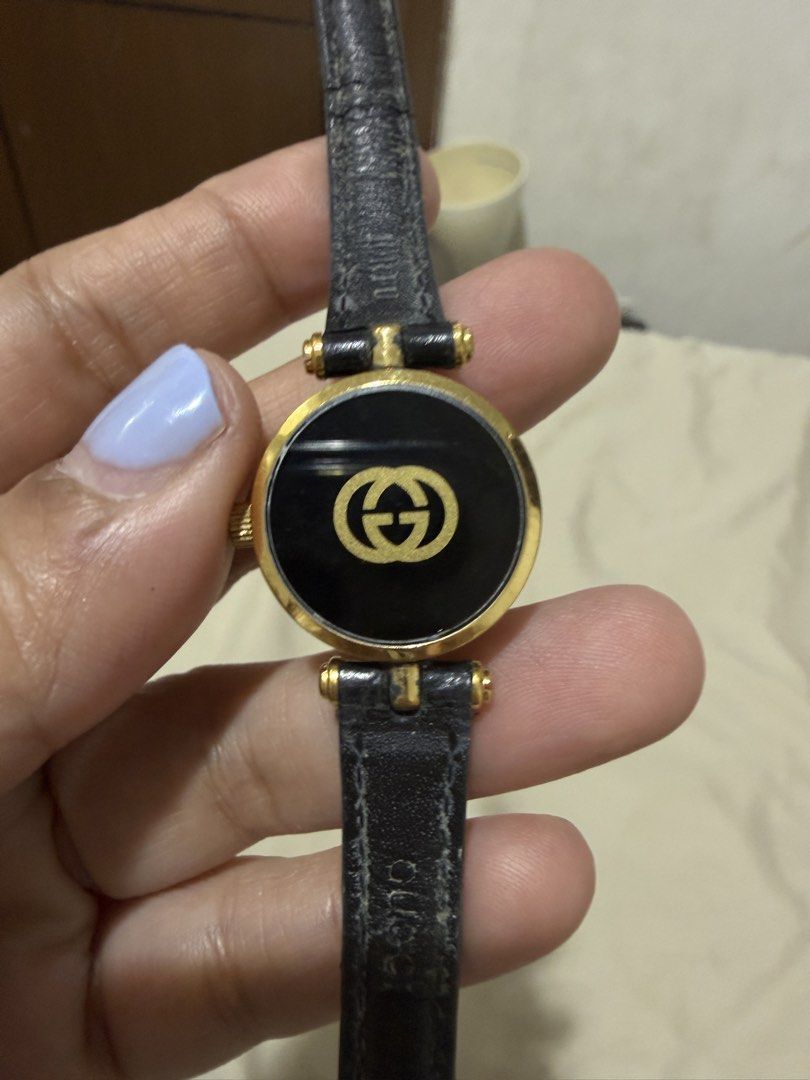 Gucci Black Dial Gold Tone Watch (Category: Women's Watches) located in Quezon City. Submitted by aaathrifts (Listing ID 1448414863, Image 3). Description: - Vintage Gucci watch - Black dial with gold GG logo - Gold tone casing - Gucci engraved buckle - Classic collectible piece - Sold as is.