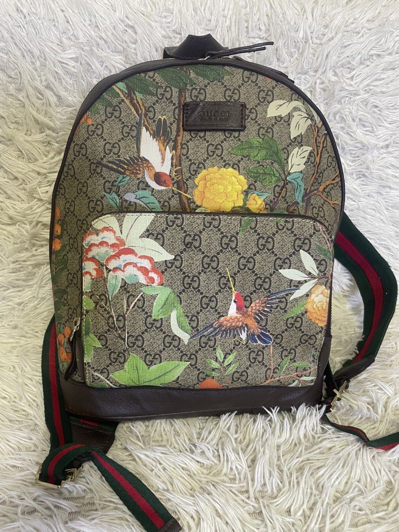 Gucci GG Supreme Blooms Backpack (Category: Luxury Bags & Wallets) located in Quezon City. Submitted by impulse.ph (Listing ID 1448351599, Image 1). Description: - Authentic Gucci GG Supreme backpack - Features a vibrant floral print - Iconic green and red stripe shoulder straps - Genuine leather trim and details - Ideal for everyday use or travel.