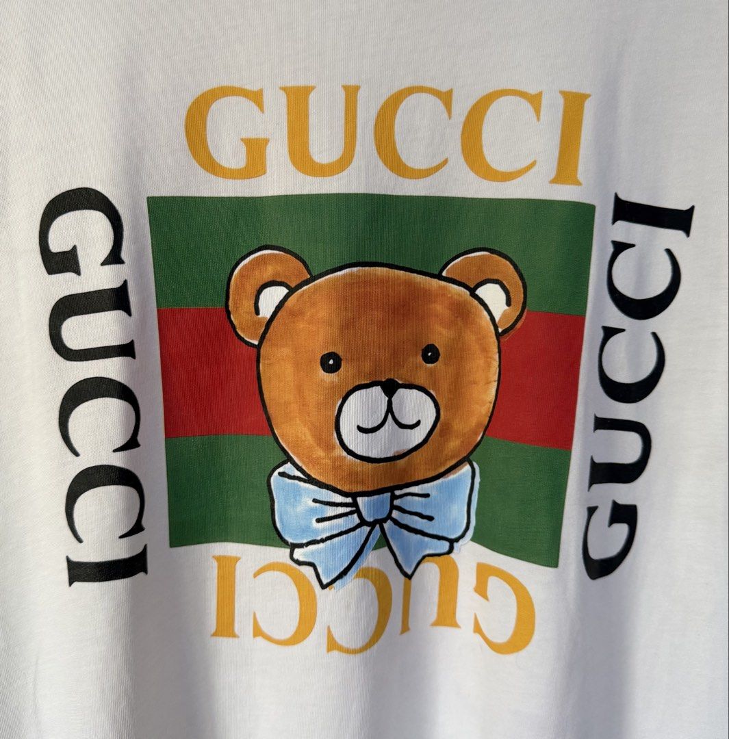 GUCCI KAI collection teddy bear white shirt (Category: Luxury Apparel) located in Baguio. Submitted by kds_stuffs (Listing ID 1448451805, Image 3). Description: Mine: 550 📍GUCC1 KAI collection teddy bear white shirt 😍 Already washed Size: M-SL Dimension: 25L x 19.5w Color rate: 9/10 Issue: bale dirt, washable Excellent condition Need wash Gandara neto 💗.