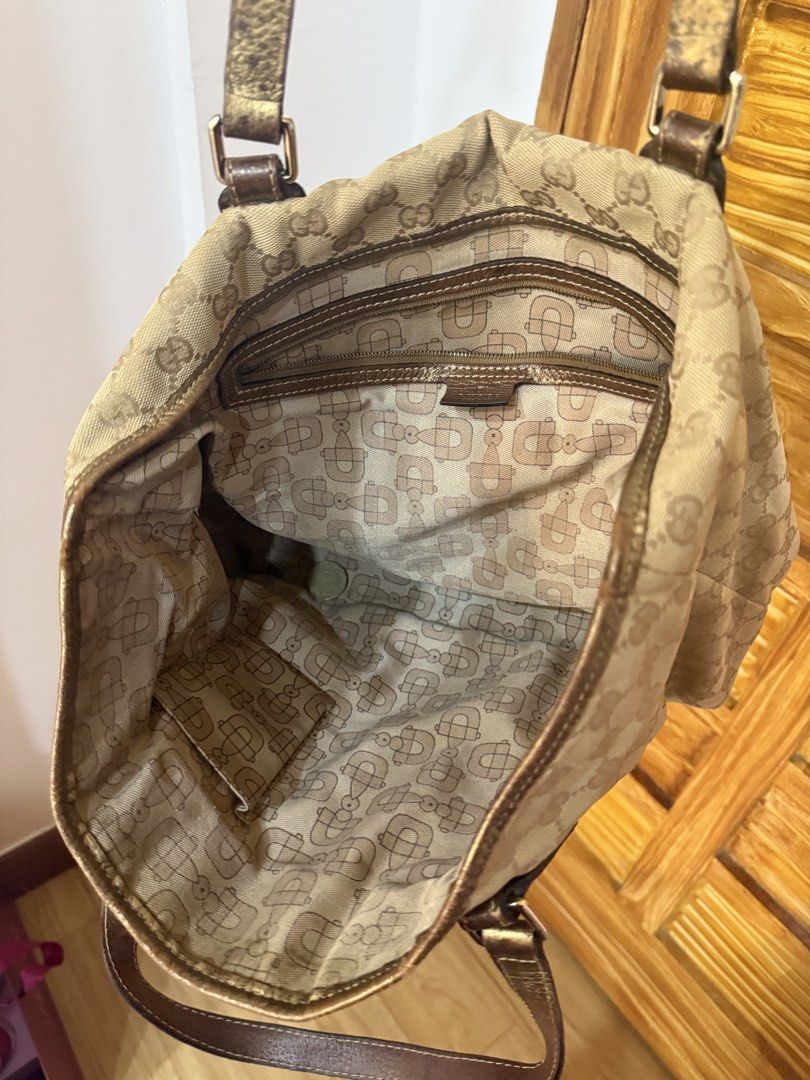 Gucci Monogram Canvas Tote Bag (Category: Luxury Bags & Wallets) located in Quezon City. Submitted by patchiii0416 (Listing ID 1448347350, Image 3). Description: - Authentic Gucci tote bag - Beige GG monogram canvas - Brown leather trim - Signature Gucci pattern interior lining - Classic, spacious everyday bag.