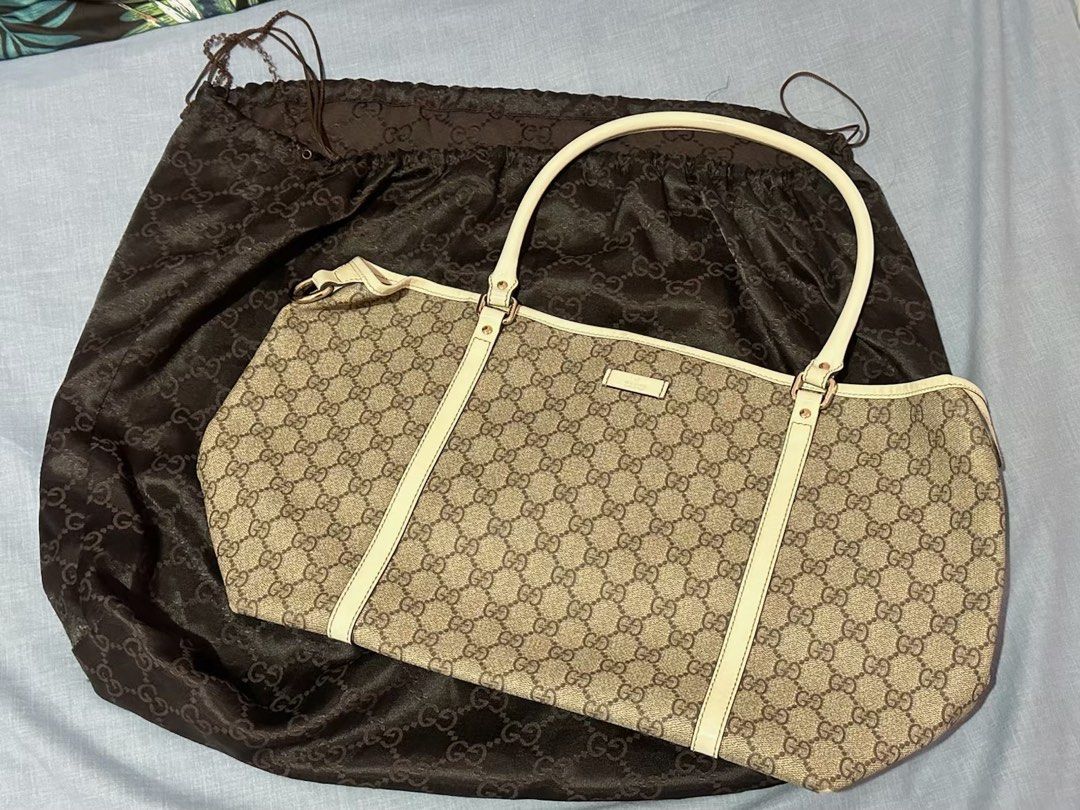Gucci Tote Bag (Category: Luxury Bags & Wallets) located in San Mateo. Submitted by jajaluscious (Listing ID 1448478468, Image 1). Description: Authentic GUCCI Brown GG PVC Canvas Off-White Leather Supreme Tote Bag Purse Sourced from Japan Selling price: 10k (negotiable) In very good condition, with dustbag..