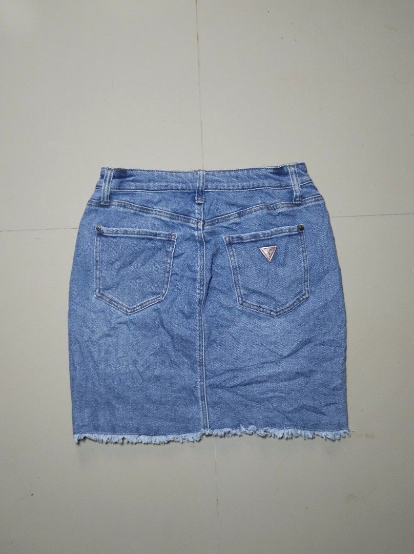 Guess Embellished Denim Mini Skirt (Category: Skirts) located in Dumaguete. Submitted by rommel159 (Listing ID 1448281377, Image 3). Description: Guess Embellished Denim Mini Skirt Size: Medium on tag Waistline: 28-30 Length: 18 Excellent Condition Location: Negros Oriental - Light wash denim mini skirt - All-over rhinestone embellishments - Gold stitching details - Frayed hemline - Classic 5-pocket styling - Zip fly with button closure - Perfect