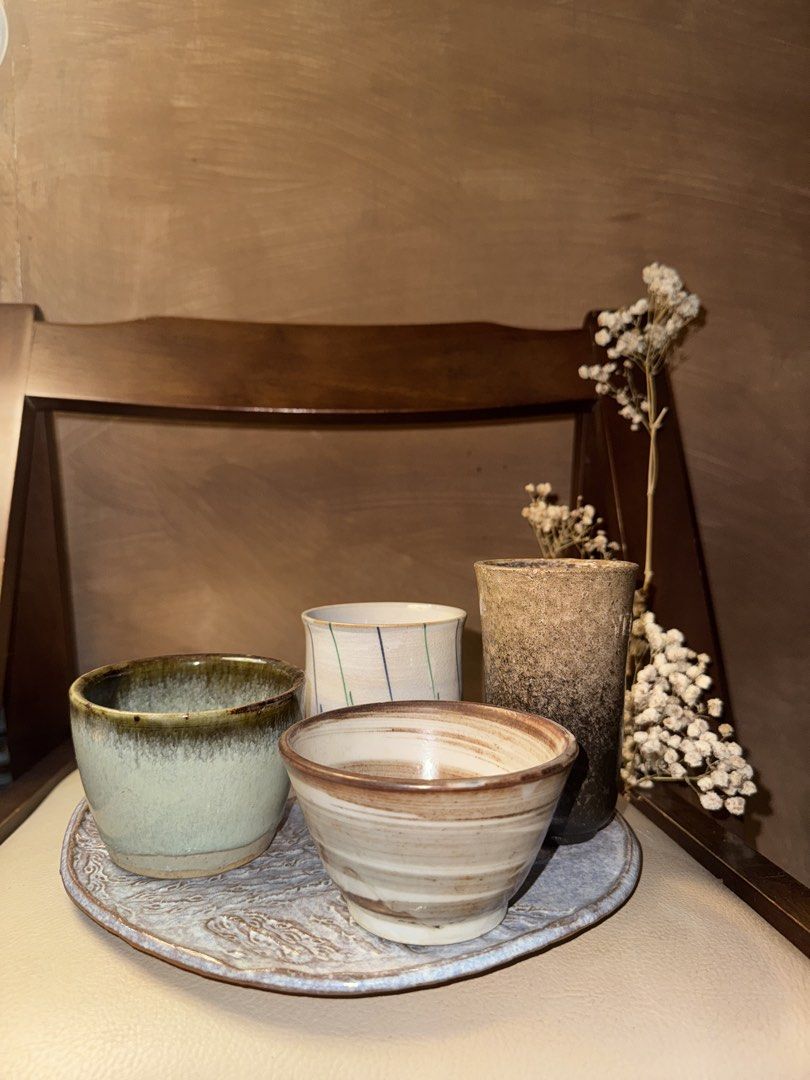 Handmade Matcha Cups and Bowl Set (Category: Other Kitchenware & Tableware) located in Makati City. Submitted by crystalwavescollection (Listing ID 1448300539, Image 1). Description: - Set of 4 unique stoneware pieces - Includes: 2 cups, 1 small bowl, 1 tall vase/cup - Rustic, handmade feel - Comes with a decorative ceramic tray - Ideal for tea, sake, or display - Adds a cozy, artisanal touch to your home.