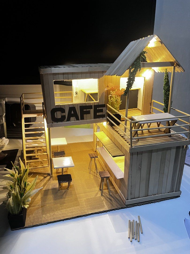 Handmade Popsicle Stick Cafe Diorama with Lights (Category: Vintage Collectibles) located in Santa Rosa. Submitted by ZzJapanAndUKSurplus (Listing ID 1448482712, Image 3). Description: - Handmade cafe diorama - Two-story design - Working lights inside - Outdoor seating area - Clearly displayed 'CAFE' sign - Made from popsicle sticks - Ideal for display or as a unique gift and school projects.