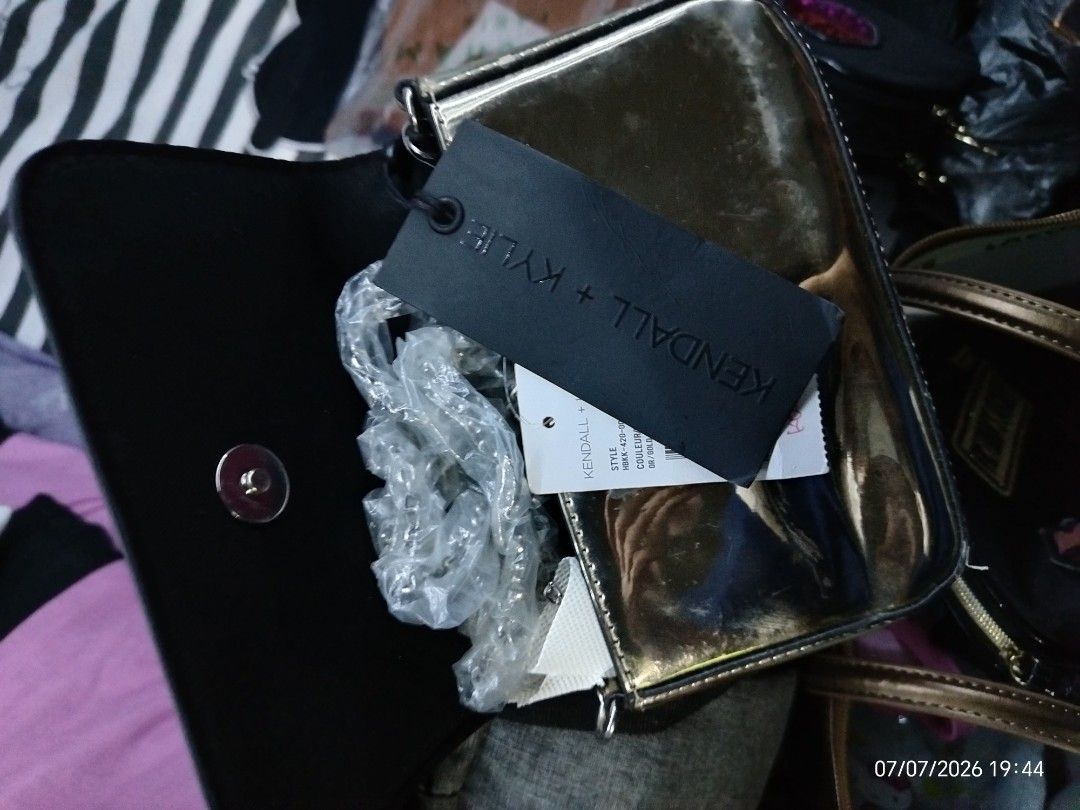 Kendall + Kylie Metallic Clutch Bag (Category: Clutches) located in Manila. Submitted by princegar32511 (Listing ID 1448461979, Image 2). Description: - Kendall + Kylie metallic clutch bag - Features brand logo on the front - Comes with original tag - Black interior - Secure magnetic closure - Ideal for nights out and special occasions.