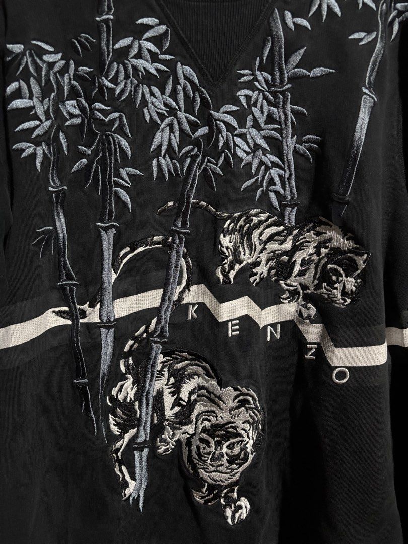 Kenzo Paris Black Tiger Bamboo Sweatshirt (Category: Luxury Apparel) located in Tagbilaran City. Submitted by noeeeelll (Listing ID 1448468162, Image 3). Description: - Black Kenzo Paris sweatshirt - Size S - Features embroidered tiger and bamboo design - Crew neck, long sleeves - Made in Portugal - Ideal for casual wear.