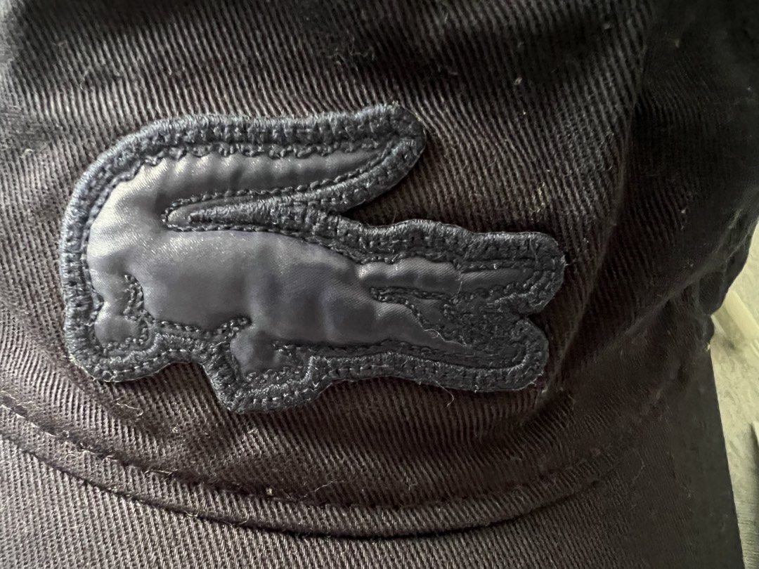 Lacoste Navy Blue Cotton Cap with Tag (Category: Caps & Hats) located in Muntinlupa City. Submitted by 09leah77 (Listing ID 1448284224, Image 2). Description: - Navy blue Lacoste cap - Made from 100% cotton - One size fits all - Comes with original tags - Ideal for everyday wear - Simple and classic design.