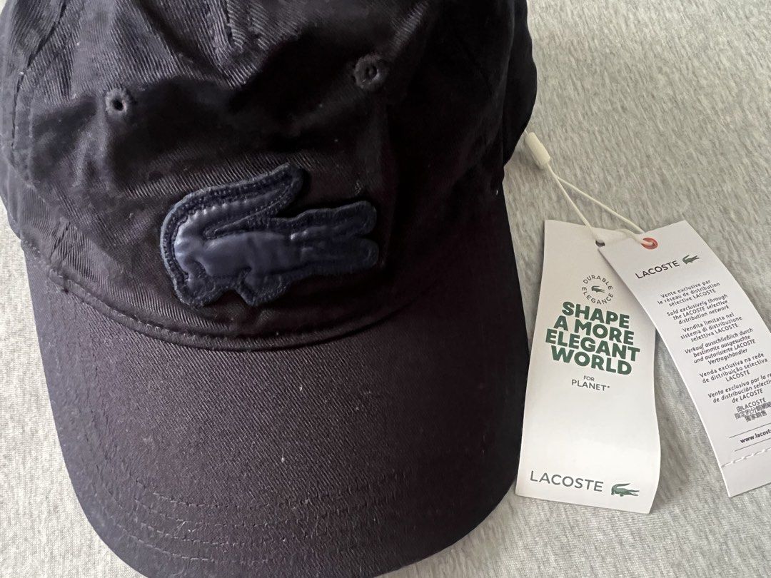 Lacoste Navy Blue Cotton Cap with Tag (Category: Caps & Hats) located in Muntinlupa City. Submitted by 09leah77 (Listing ID 1448284224, Image 1). Description: - Navy blue Lacoste cap - Made from 100% cotton - One size fits all - Comes with original tags - Ideal for everyday wear - Simple and classic design.